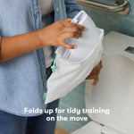 Frida Baby Fold-and-Go Portable Potty Seat for Toilet, Foldable Travel Potty Seat for Toddler, Fits Round & Oval Toilets, Non-Slip Base, Handles, Includes Free Travel Bag