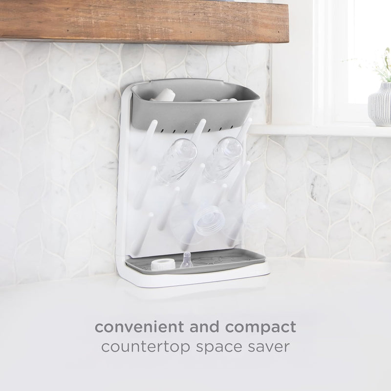 Ubbi Vertical Baby Bottle Drying Rack, Space Saving Countertop Bottle Dryer | 13-Peg Bottle Drying Rack Removable Drain Tray, Baby Organizer for Pump Parts, Pacifiers & Accessories, Dishwasher Safe, Gray