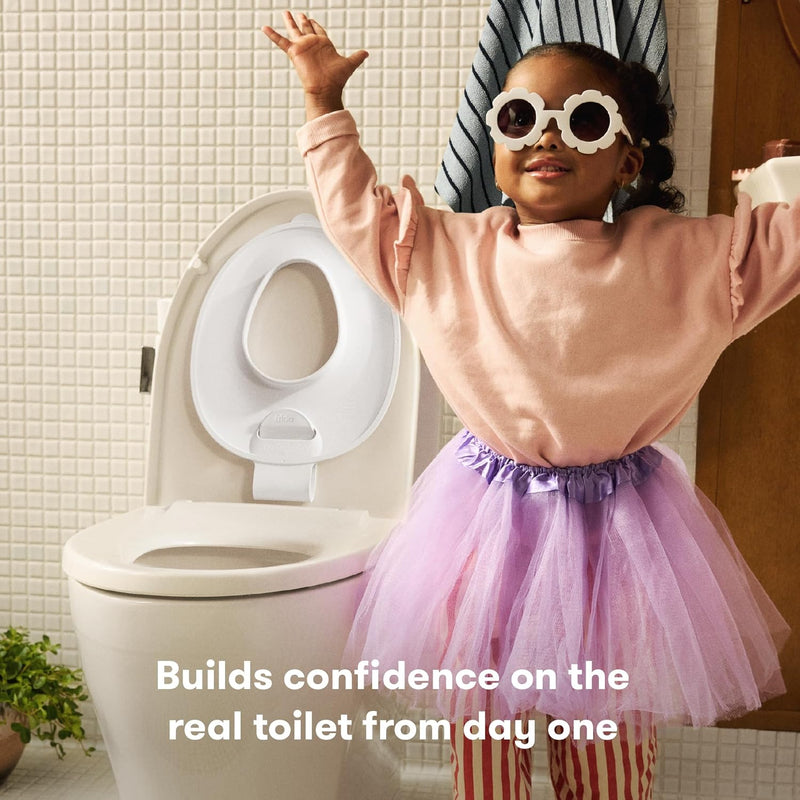 Frida Baby Drop Down Potty Training Seat for Toddlers & Kids, Easy to Clean | Attaches Securely to Adult Toilet, Flips Up or Down for Kid Ready Access, Stable & Easy to Clean