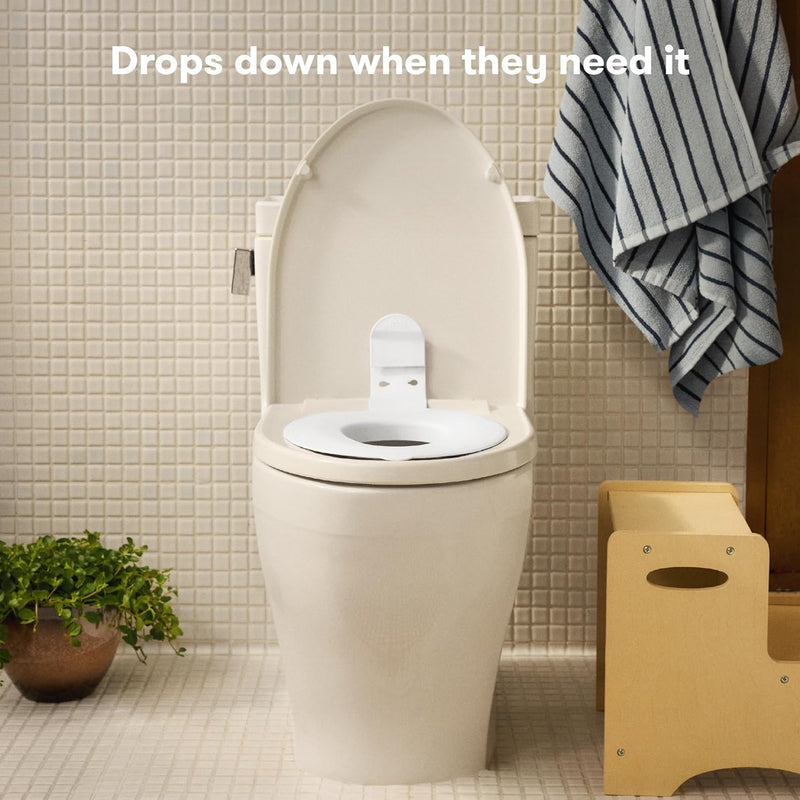 Frida Baby Drop Down Potty Training Seat for Toddlers & Kids, Easy to Clean | Attaches Securely to Adult Toilet, Flips Up or Down for Kid Ready Access, Stable & Easy to Clean